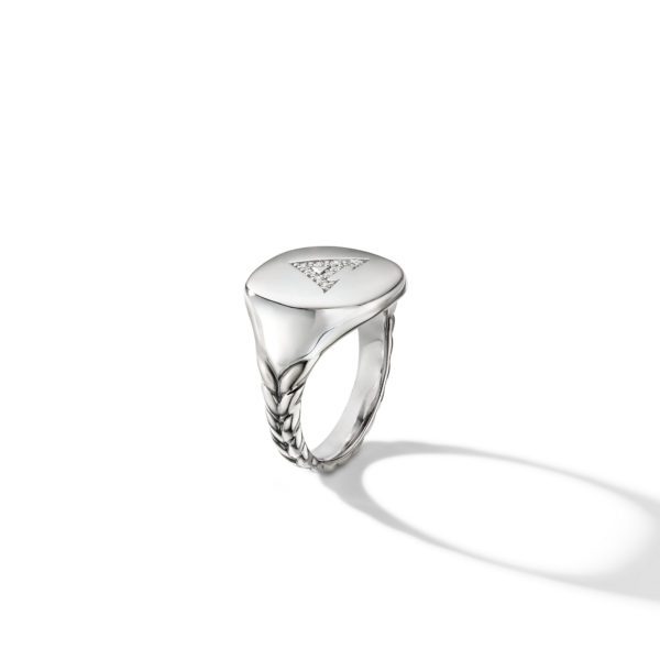 A silver signet ring with a smooth, polished surface displays an engraved triangular design adorned with small diamonds. The band features an intricate braided pattern. The ring is positioned against a plain white background, casting a faint shadow.