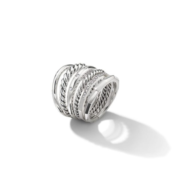 A silver ring featuring multiple intertwined bands with varying textures, including smooth, twisted, and diamond-studded sections. The ring casts a slight shadow on the white background.