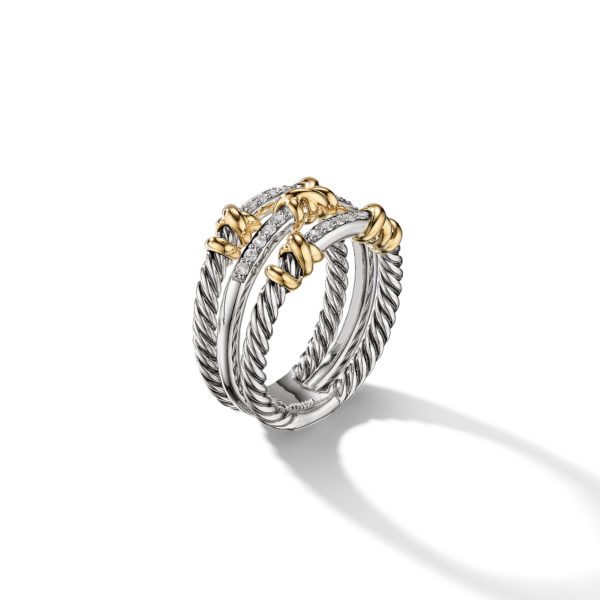 A stylish silver and gold ring featuring three intertwined bands with twisted rope patterns. The ring is adorned with small diamonds set in a horizontal arrangement on the top and gold accents strategically placed for an elegant look. It casts a soft shadow on a white background.