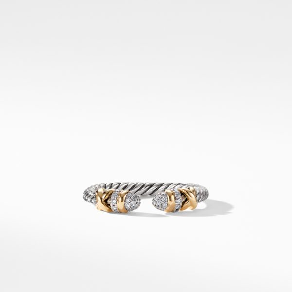 A silver cable-style ring with open ends, each adorned with a cluster of small diamonds set in round, golden settings. The ring's twisted design adds texture, and the contrast of the metals highlights its elegant, modern aesthetic.