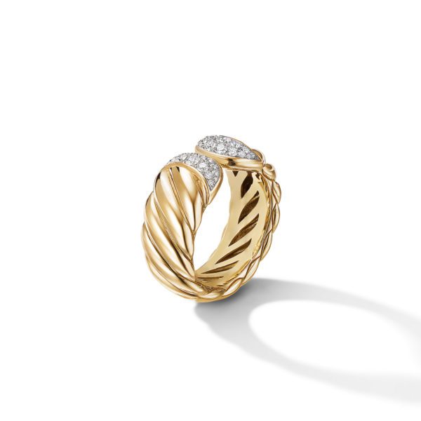 A gold ring featuring an intertwined, rope-like design with two ends adorned with small, sparkling diamonds. The ring is set against a plain white background, casting a subtle shadow.