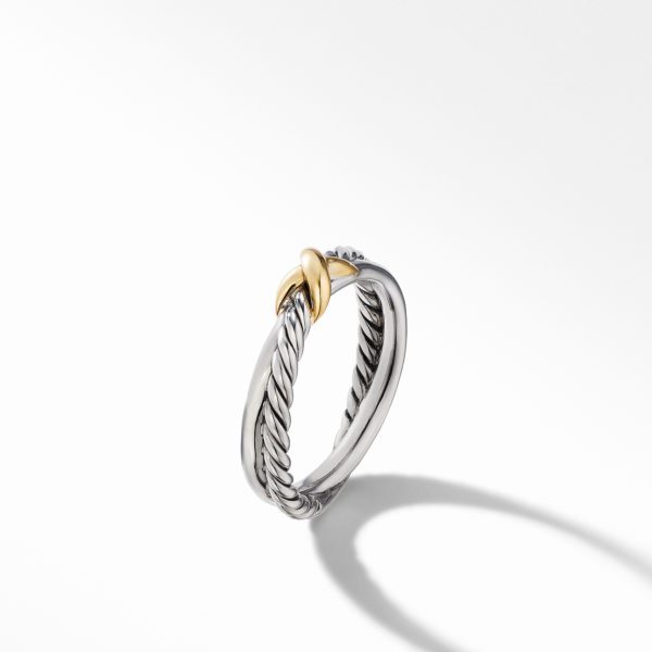 A silver twisted cable ring with a single interwoven gold X-shaped accent, shown on a white background with a soft shadow.