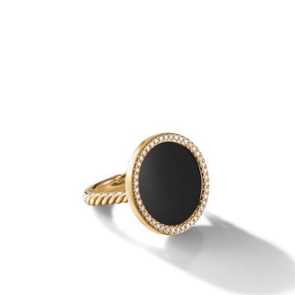 A gold ring featuring a large, round black onyx center stone surrounded by a halo of small diamonds. The band has a twisted rope design. The ring is displayed against a white background with a soft shadow.