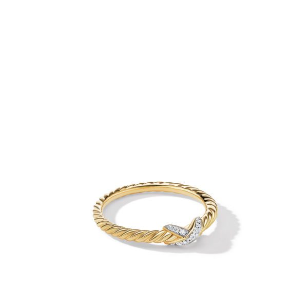 A delicate gold ring with a twisted rope design. The focal point features a crisscross element adorned with small sparkling diamonds, creating an elegant and sophisticated look. The ring is set against a plain white background, casting a slight shadow.