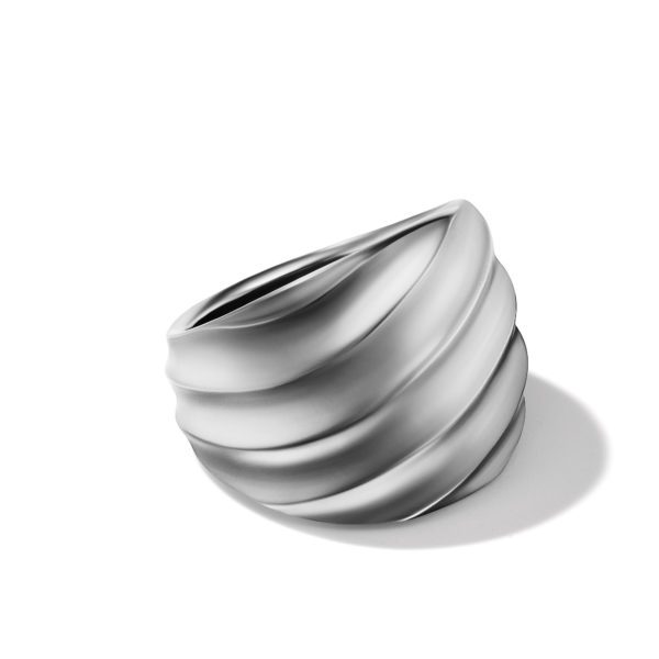 A sleek, modern silver ring with a spiral, layered design against a white background. The ring has smooth, curved layers that add depth to its appearance. A subtle shadow is cast on the surface.