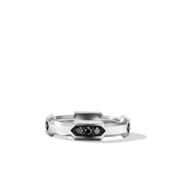 A sleek silver band ring, featuring three black gemstones set in an angular design. The ring has a modern and minimalist aesthetic, with a smooth, reflective surface and geometric detailing. The background is plain white.