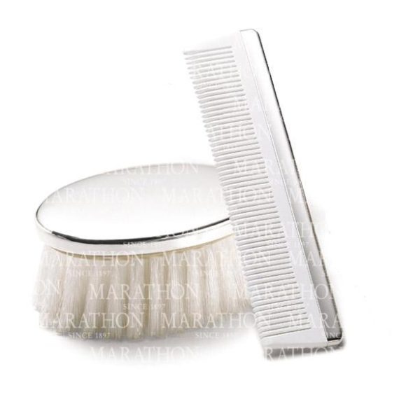 Introducing the Marathon Sterling Silver Boys' Brush and Comb Set: An elegant white baby hairbrush and comb set with a refined silver finish. The brush is designed with soft bristles and a smooth sterling silver handle, while the comb features fine teeth for gentle grooming, both showcasing understated luxury and care for your infant's hair.