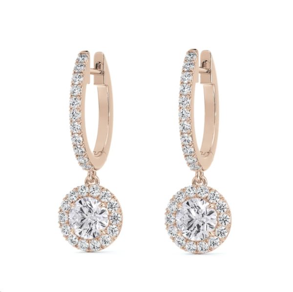 The Forevermark Center of My Universe Pavé Huggies with Halo Diamond Drops are a pair of elegant rose gold hoop earrings adorned with small circular white diamonds. Each earring features a larger round diamond set within a halo of smaller diamonds, hanging from the bottom of the hoop. The design is delicate and sparkling.