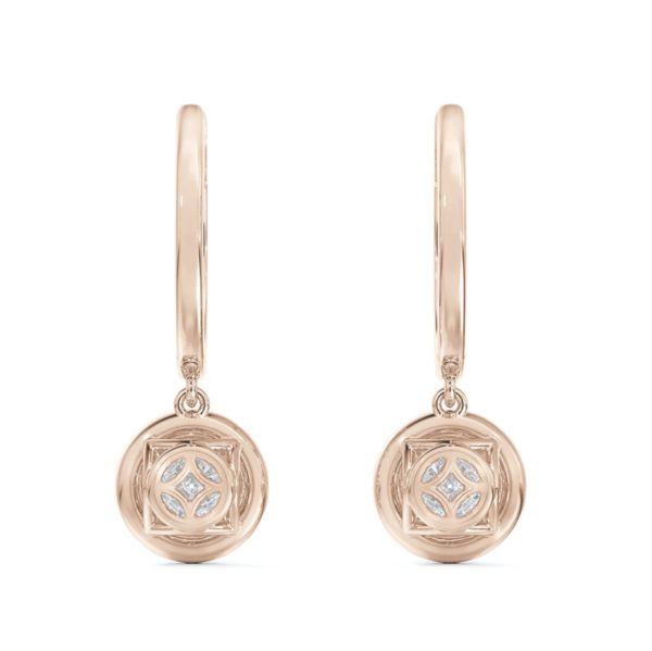 The Forevermark Center of My Universe Pavé Huggies with Halo Diamond Drops are exquisite gold hoop earrings adorned with intricate, hanging round pendants. The pendants boast an engraved pattern and are centered with small, sparkling diamonds, creating an overall elegant and stylish design.