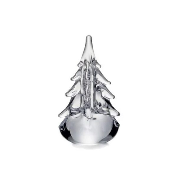 The Simon Pearce Five-Sided Evergreen - 6" is a clear glass ornament shaped like a Christmas tree with defined branches, set against a plain white background. The glass has a smooth, shiny surface, giving the tree an elegant, polished look.