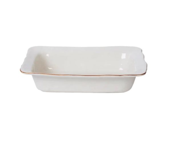 The Skyros Cantaria Medium Rectangular Baker in white features a glossy, smooth surface. It boasts slightly flared and scalloped edges with a thin brown rim, and currently appears empty.