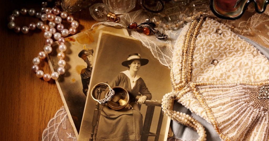 Collage of antiques, collectibles, and heirloom jewelry with sepia photographs of a soldier and his wife