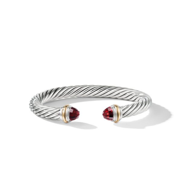 A silver twisted cable bracelet with two red gemstone caps on each end. The design features gold accents around the gemstones, giving the bracelet an elegant and sophisticated appearance against a plain white background.