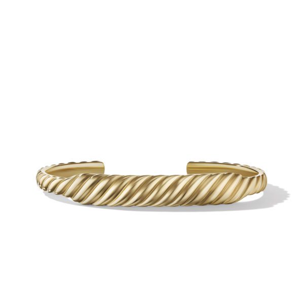 A gold cuff bracelet with a twisted rope design is displayed against a white background. The bracelet is open-ended, shiny, and has a smooth, polished finish.