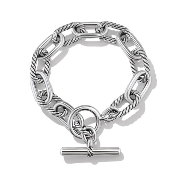 A silver chain bracelet featuring twisted rope-style links and an oversized toggle clasp. The links have a robust, interlocked design, and the clasp consists of a horizontal bar that fits into an open circular ring. The bracelet is displayed against a white background.