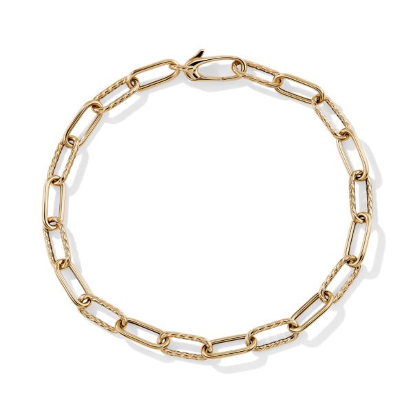 A gold chain necklace with elongated, interlocking links forming a complete circle. The necklace is simple and elegant, with a polished finish, and is laid out flat against a plain white background.