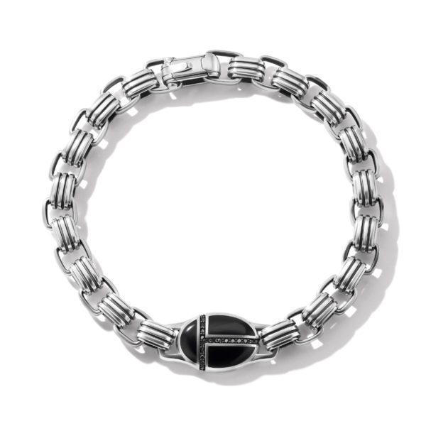 A sleek, silver chain bracelet with a prominent black clasp, which is decorated with small, black gemstones. The bracelet features interlocking rectangular links, creating a modern, elegant look. The image is set against a plain white background.