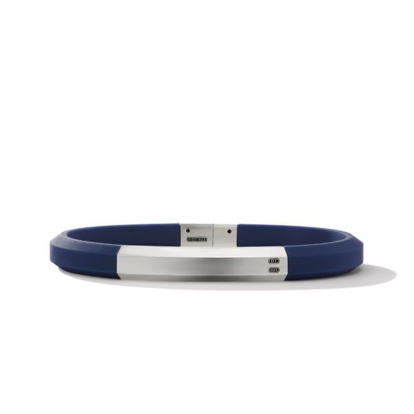 A sleek, modern bracelet featuring a blue band with a polished silver clasp. The clasp has a minimalist design with subtle engraving details. The bracelet is displayed on a plain white background, casting a faint shadow.