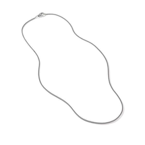 An image of a thin silver chain necklace with a clasp, laid out smoothly on a white background. The chain appears delicate and evenly linked, ending in a small, secure clasp.