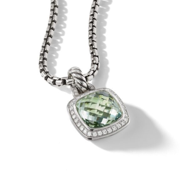 A silver chain necklace features a square pendant with a green gemstone set in the center. The gemstone is bordered by small white diamonds, and the pendant's bail has a twisted rope design. The necklace is photographed on a white background.