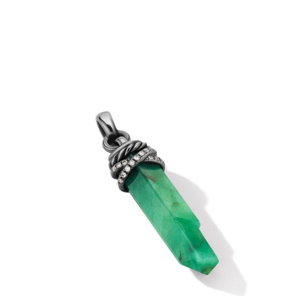 An emerald-colored crystal pendant with a pointed tip, set in a dark metal casing with a decorative band of small, sparkling diamonds around the top. The pendant has a loop for attaching it to a chain or necklace. The background is white.