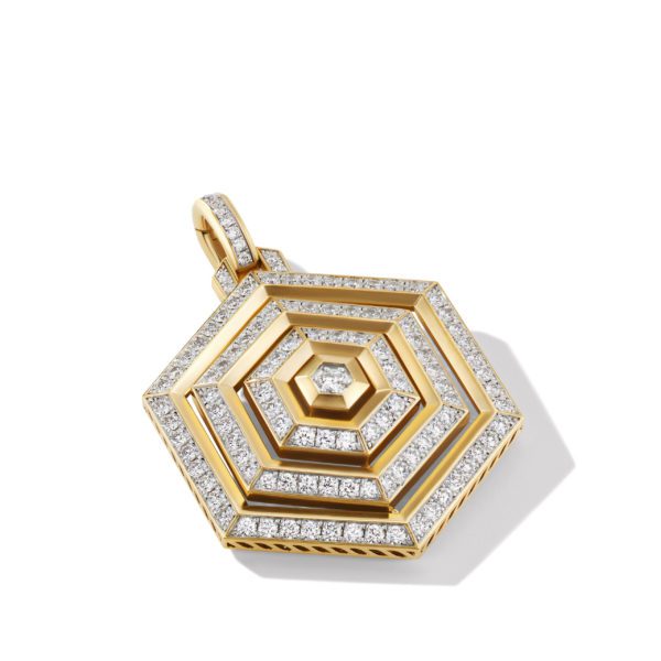 A hexagonal gold pendant adorned with concentric rows of small diamonds, forming a geometric pattern. The pendant has a polished gold bail at the top for attaching to a chain. The design is elegant and symmetrical, with a modern and luxurious appearance.