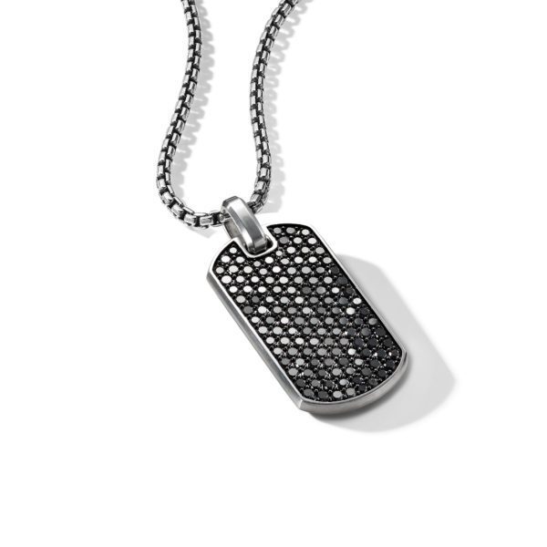 A silver rectangular pendant on a textured chain. The pendant is adorned with numerous small black crystals, creating a sparkling effect. The background is white, highlighting the necklace's intricate design.