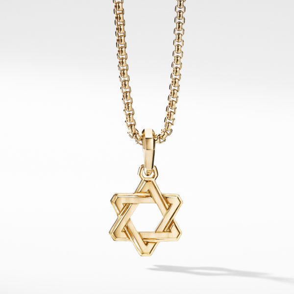 A gold necklace features a chain with a Star of David pendant. The pendant has an intertwined, geometric design. The background is plain white.