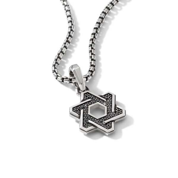 A silver chain necklace with a black and silver Star of David pendant featuring intricate detailing and small black stones. The pendant combines geometric design with a hexagonal center, highlighting modern style. The necklace is displayed on a white background.