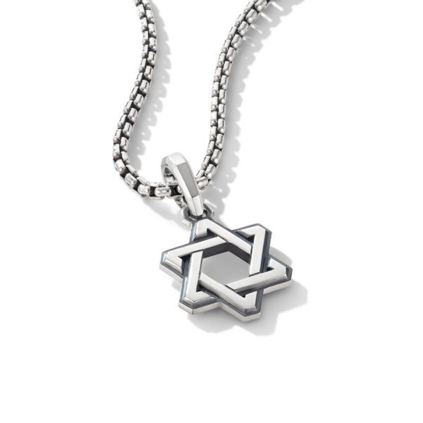 A silver necklace with a thick chain features a pendant shaped like a six-pointed star, resembling the Star of David. The star pendant has interlocking triangles, giving it a three-dimensional appearance. The necklace is displayed against a white background.