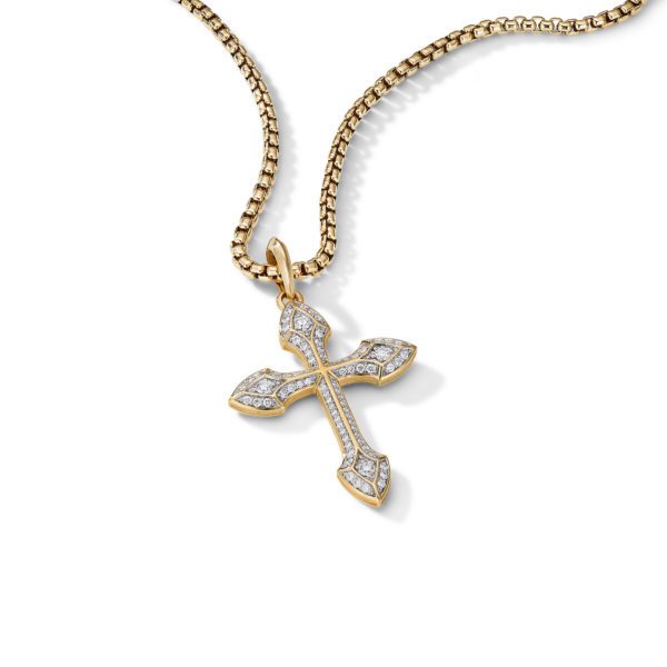 Gold chain necklace with a cross pendant. The pendant is gold with intricate designs and features embedded small diamonds that add sparkle. The chain appears to be a box chain, giving it a sturdy but elegant look against a white background.