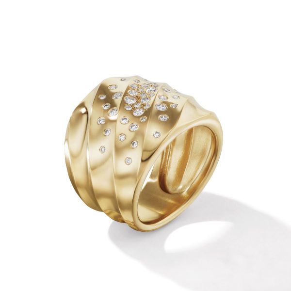 A wide gold ring featuring a smooth, sculpted design with multiple small diamonds embedded in a central cluster pattern. The ring has a polished finish, creating a shadow on the white background.