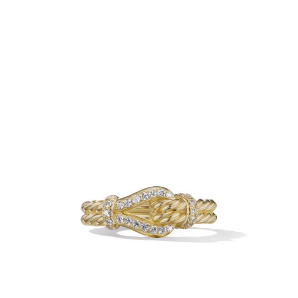 A gold ring with a twisted rope design and an intricate knot featuring small sparkling diamonds along its edges, set against a plain white background.