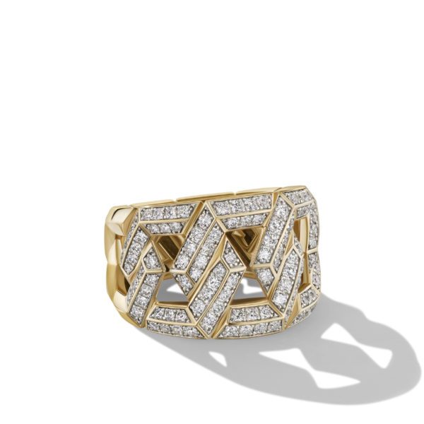 A gold ring with an intricate geometric pattern, adorned with numerous small diamonds. The ring has a modern, bold design with diamond-studded zigzagging shapes that create an eye-catching texture.