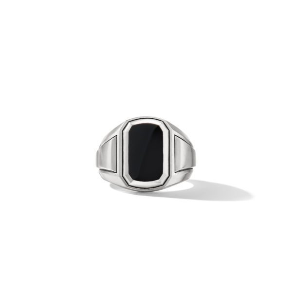 A silver ring with a sleek, rectangular black onyx stone set in the center. The ring features angular geometric lines that converge at the central, polished stone. It is displayed against a white background with a slight shadow on one side.