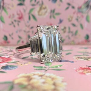 emerald cut three stone engagement ring