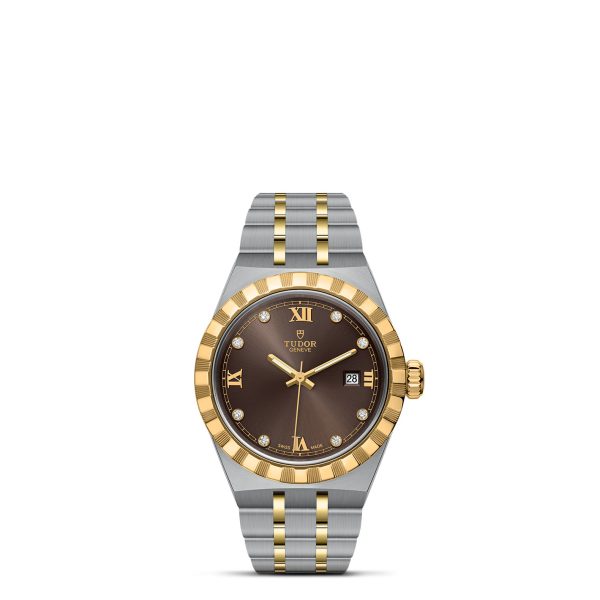 The TUDOR Royal wristwatch is a luxurious timepiece featuring a two-tone silver and gold stainless steel band. It boasts a black dial adorned with gold Roman numerals at the 12 and 6 o'clock positions, diamond hour markers, and a date display at the 3 o'clock position.