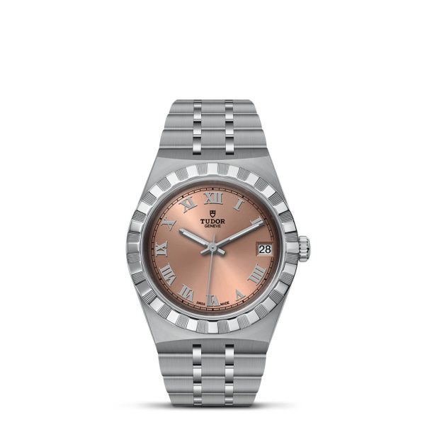 A TUDOR Royal wristwatch crafted from stainless steel, featuring a silver bracelet. The watch boasts a salmon pink dial with Roman numeral hour markers, a date window at the 3 o'clock position, and the brand name "TUDOR" displayed beneath the 12 o'clock mark. It is completed with a fluted bezel.