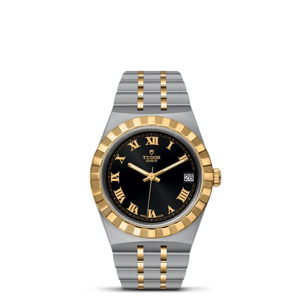 The TUDOR Royal is a luxury wristwatch featuring a striking two-tone design with a silver and gold metal band. Its elegant black watch face is adorned with gold Roman numeral hour markers, and it includes a date display situated at the 3 o'clock position, along with the brand name "TUDOR" prominently displayed on the face.