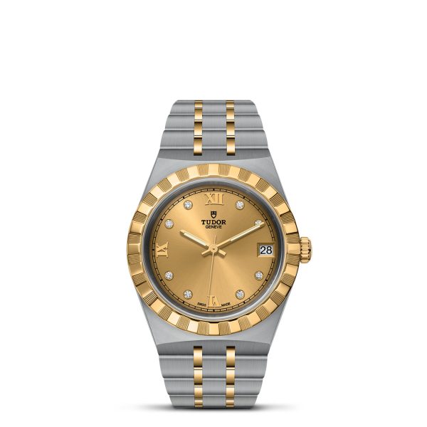 The TUDOR Royal is a luxury wristwatch with a polished two-tone stainless steel and gold bracelet. It features a round gold dial adorned with diamond hour markers, Roman numerals at 12 and 6 o'clock, and a date window at 3 o'clock. The bezel is fluted gold, and the brand "TUDOR" is prominently displayed under the 12 o'clock position.