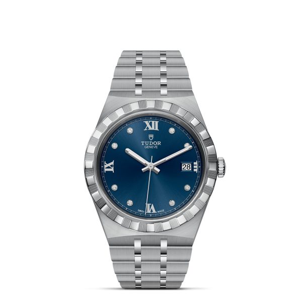 The TUDOR Royal wristwatch boasts a polished stainless steel case, a deep blue dial adorned with Roman numerals and diamond hour markers, a date display at the 3 o'clock position, and is finished with a fluted bezel. It also features a metal link bracelet.