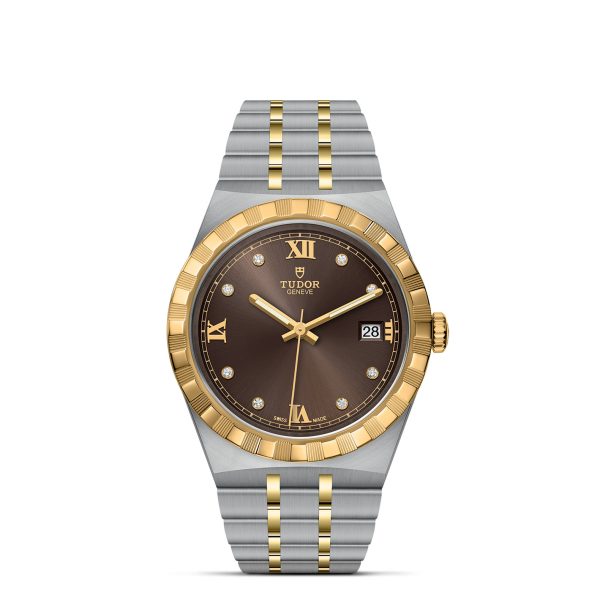 Here's an rewritten version using the given product data:

The TUDOR Royal is a stylish wristwatch featuring a two-tone design with a brown dial adorned with Roman numerals and diamond hour markers. The bezel and center links showcase a gold-toned finish, while the case and outer links are elegantly silver. The watch includes a date display at the 3 o'clock position and proudly displays the Tudor logo at 12 o'clock.