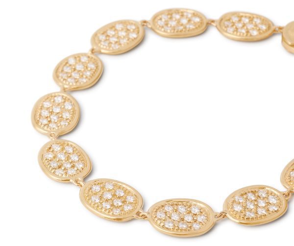 Introducing the Marco Bicego Lunaria Pave Diamond Link Bracelet, featuring elegant oval links adorned with clusters of small, sparkling diamonds arranged in a circular pattern. This intricate design reflects light beautifully in multiple directions.