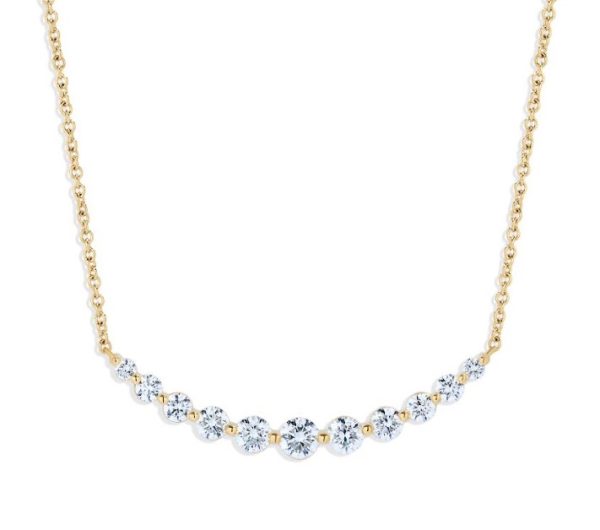 The Bromberg's Signature Collection Curved Diamond Bar Necklace features a delicate gold chain centered with a row of gradually smaller round diamonds, creating a stunning graduated effect. The diamonds are evenly spaced and the fine gold chain gives the piece an elegant and sophisticated appearance.