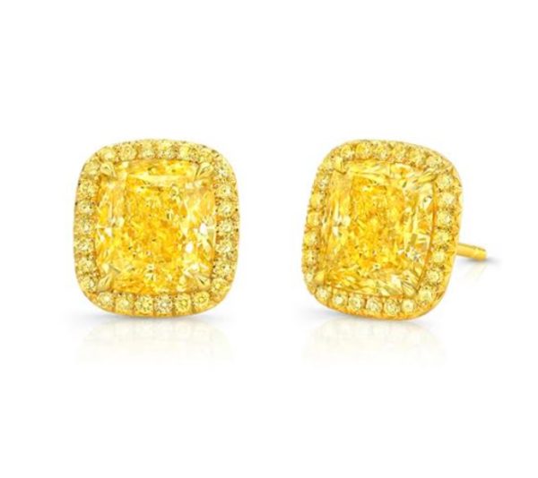 The Bromberg's Signature Collection Fancy Yellow Diamond Halo Earrings are set in yellow gold and feature a large central radiant-cut yellow diamond in each earring, surrounded by a halo of smaller yellow diamonds, creating a vibrant and luxurious appearance.