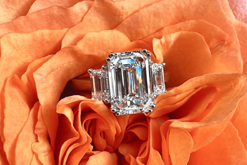 Diamond ring resting in an orange rose. Bromberg’s has the jewelry to bring Thanksgiving outfit ideas to life.