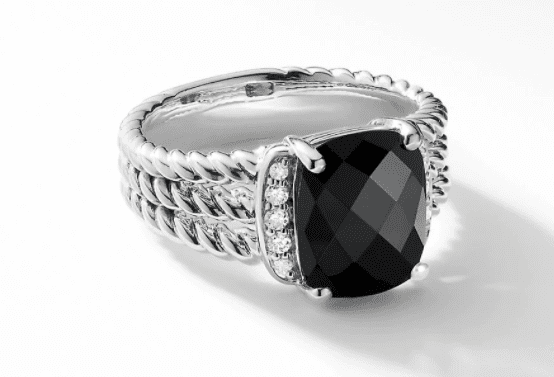 The PETITE WHEATON RING BO is a silver ring that boasts a twisted rope design band, with a large square-cut black gemstone at its center and small diamond accents adorning each side. The ring is showcased on a white background.