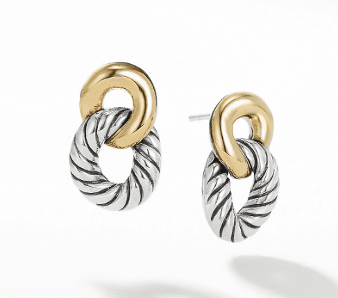 The BELMONT DROP EARRINGS feature a pair of elegant, intertwined oval loops. Each earring showcases a smooth gold oval at the top linked to a textured silver oval with a twisted design, creating a sophisticated two-tone look.