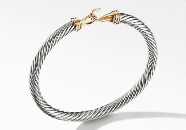 Introducing the 5MM BUCKLE BRACELET, a luxurious piece featuring a sophisticated twisted rope design with two tones: silver and gold. The bracelet's gold clasp is uniquely crafted like two hooks that interlock, adding an elegant touch. It is stylishly displayed against a plain white background.