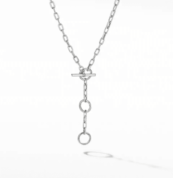 The MADISON 3 RING CHAIN features a minimalist silver chain necklace with a toggle clasp, adorned with three evenly spaced circular links hanging vertically from the center. The necklace is elegantly displayed on a plain white background.